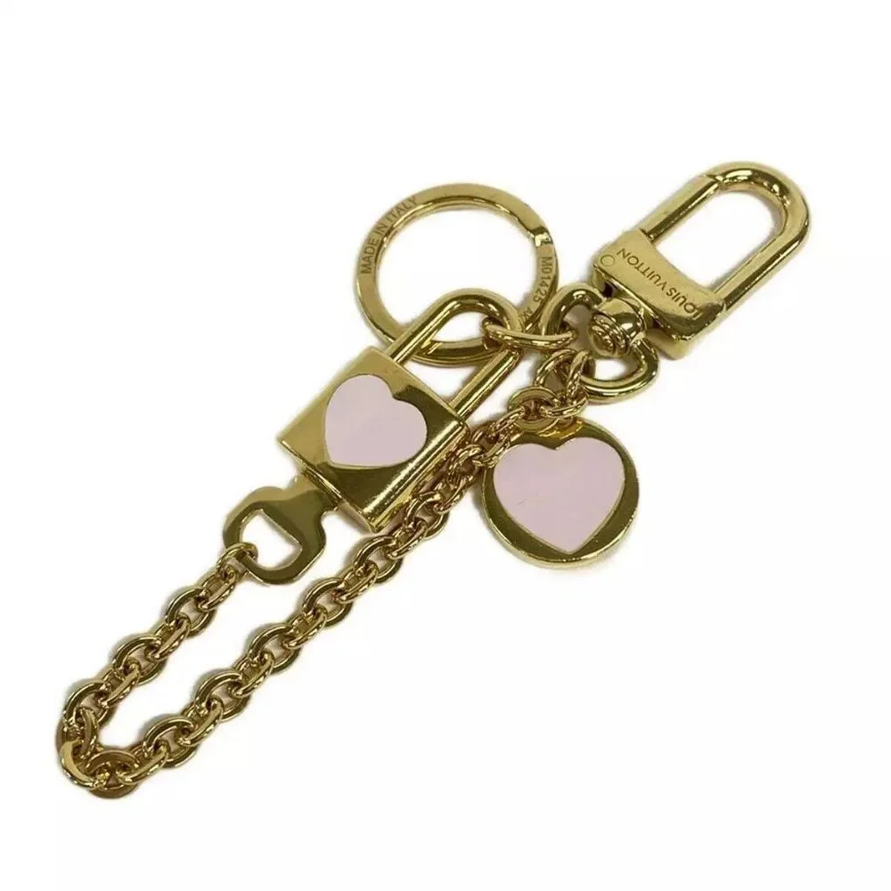 100% Authentic LOUIS VUITTON GP Metal Enameled Heart Gold Bag Charm - Picture 1 of 5